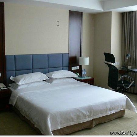 New Land Business Hotel Wuhan Habitación foto