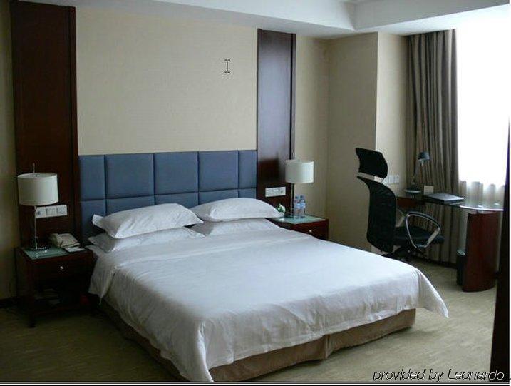 New Land Business Hotel Wuhan Habitación foto
